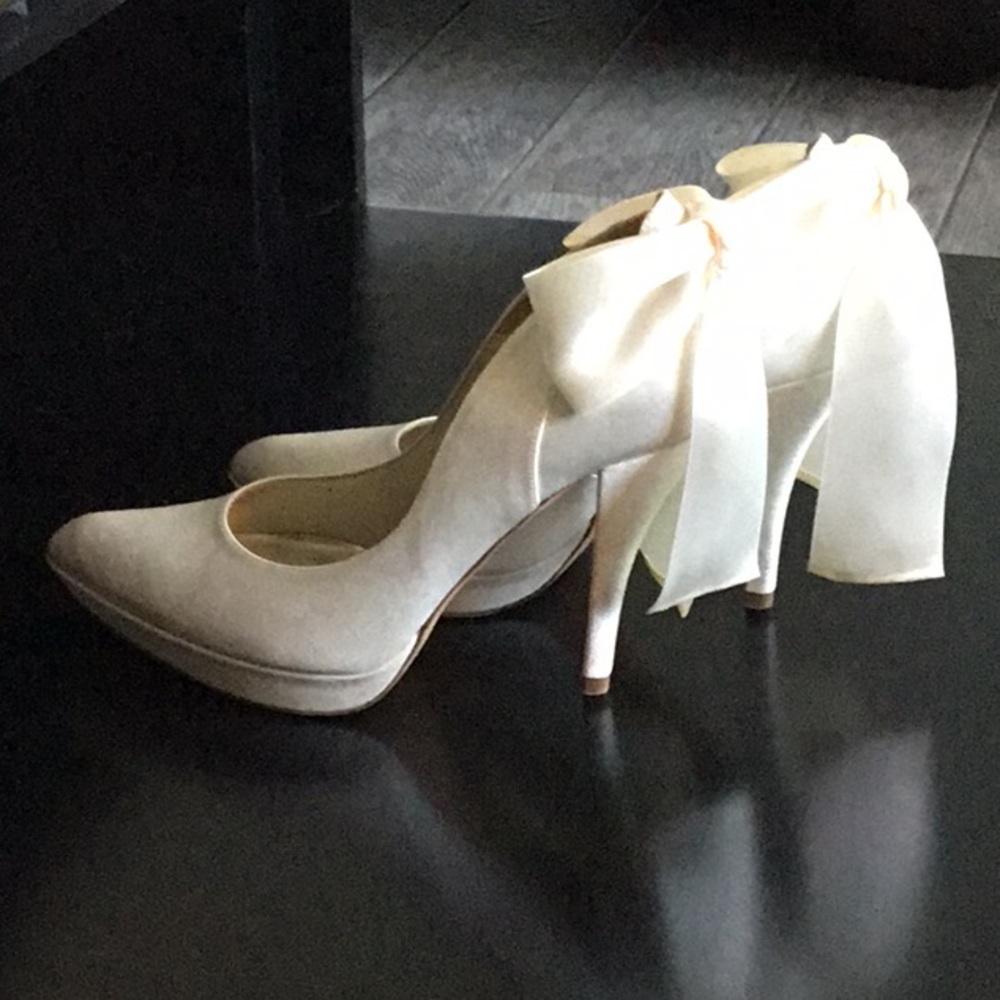 White satin shoes by Pura Lopez
